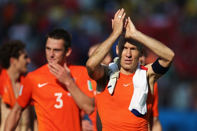 SAO PAULO, BRAZIL - JUNE 23:  Arjen Robben (R) and Stefan de Vrij of the Netherlands thank the fans after victory in the 2014 FIFA World Cup Brazil Group B match between the Netherlands and Chile at Arena de Sao Paulo on June 23, 2014 in Sao Paulo, Brazil.  (Photo by Dean Mouhtaropoulos/Getty Images)