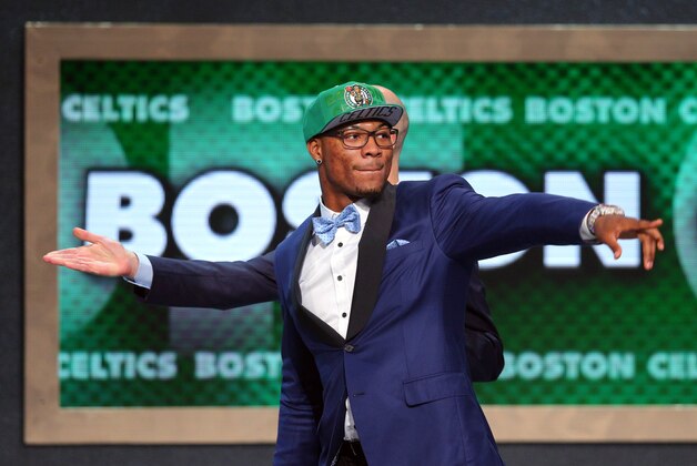 Jun 26, 2014; Brooklyn, NY, USA; Marcus Smart (Oklahoma State) gestures as he leaves the stage after being selected as the number six overall pick to the Boston Celtics in the 2014 NBA Draft at the Barclays Center. Mandatory Credit: Brad Penner-USA TODAY Sports
