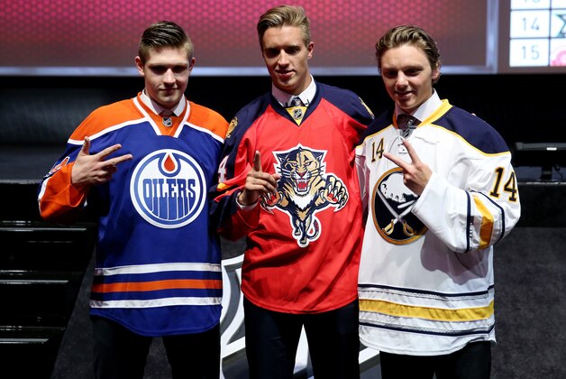 PHILADELPHIA, PA - JUNE 27:  (L-R) Leon Draisaitl third overall pick by the Edmonton Oilers, Aaron Ekblad first overall pick by the Florida Panthers, and Sam Reinhart the second overall pick by the Buffalo Sabres pose during the first round of the 2014 NHL Draft at the Wells Fargo Center on June 27, 2014 in Philadelphia, Pennsylvania.  (Photo by Bruce Bennett/Getty Images)