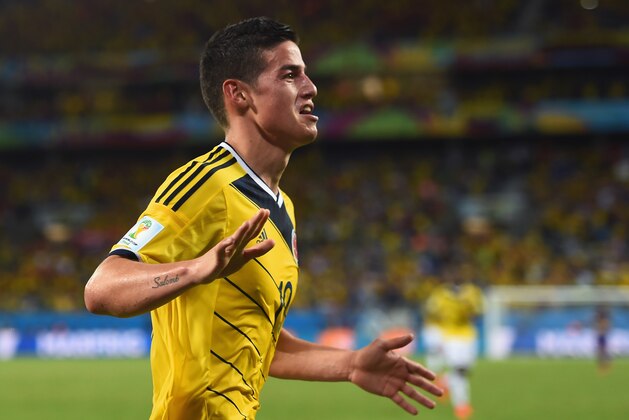 CUIABA, BRAZIL - JUNE 24:  James Rodriguez of Colombia celebrates scoring his team's fourth goal during the 2014 FIFA World Cup Brazil Group C match between Japan and Colombia at Arena Pantanal on June 24, 2014 in Cuiaba, Brazil.  (Photo by Christopher Lee/Getty Images)