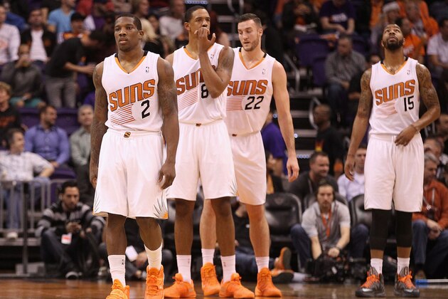 PHOENIX, AZ - DECEMBER 18:  (L-R) Eric Bledsoe #2, Channing Frye #8, Miles Plumlee #22 and Marcus Morris #15 of the Phoenix Suns during the NBA game against the San Antonio Spurs at US Airways Center on December 18, 2013 in Phoenix, Arizona. The Spurs defeated the Suns 108-101. NOTE TO USER: User expressly acknowledges and agrees that, by downloading and or using this photograph, User is consenting to the terms and conditions of the Getty Images License Agreement.  (Photo by Christian Petersen/Getty Images)