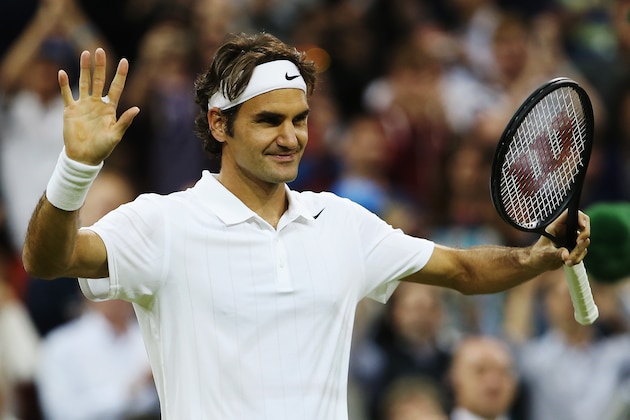 LONDON, ENGLAND - JUNE 26:  Roger Federer of Switzerland celebrates victory following his Gentlemen's Singles second round match against Gilles Muller of Luxembourg on day four of the Wimbledon Lawn Tennis Championships at the All England Lawn Tennis and Croquet Club at Wimbledon on June 26, 2014 in London, England.  (Photo by Jan Kruger/Getty Images)