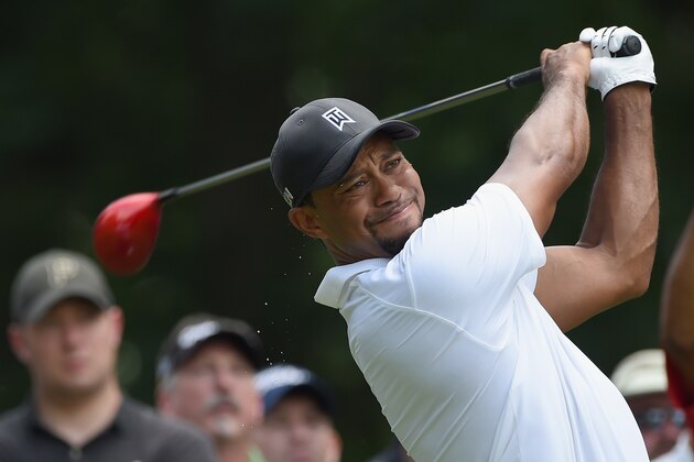 BETHESDA, MD - JUNE 27:  Tiger Woods of the United States watches his tee shot on the fourt hole during the second round of the Quicken Loans National at Congressional Country Club on June 27, 2014 in Bethesda, Maryland.  (Photo by Patrick Smith/Getty Images)