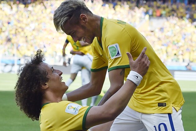 Brazil's David Luiz, left, and Neymar celebrate after Brazil's opening goal during the World Cup round of 16 soccer match between Brazil and Chile at the Mineirao Stadium in Belo Horizonte, Brazil, Saturday, June 28, 2014. (AP Photo/Martin Meissner)