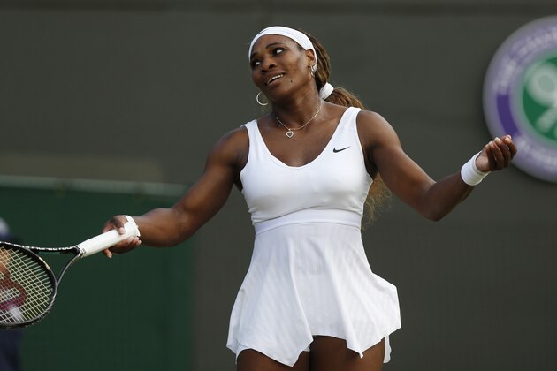 Serena Williams of U.S. gestures during the women's singles match against Alize Cornet of France at the All England Lawn Tennis Championships in Wimbledon, London, Saturday, June 28, 2014. (AP Photo/Sang Tan)
