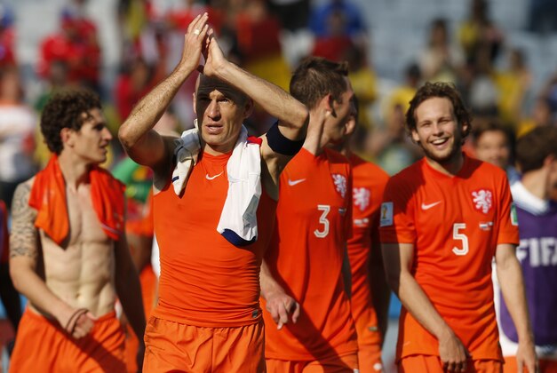 Netherlands' Arjen Robben acknowledges the fans after the group B World Cup soccer match between the Netherlands and Chile at the Itaquerao Stadium in Sao Paulo, Brazil, Monday, June 23, 2014. The Dutch team beat Chile 2-0 to top Group B. (AP Photo/Frank Augstein)