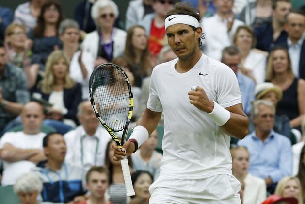 Rafael Nadal of Spain reacts after winning a point against Mikhail Kukushkin of Kazakhstan during their men's singles match on Centre Court at the All England Lawn Tennis Championships in Wimbledon, London, Saturday, June 28, 2014. (AP Photo/Ben Curtis)