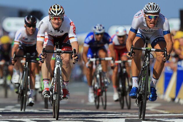 ST MALO, FRANCE - JULY 09:  Marcel Kittel (R) of Germany riding for Team Argos-Shimano beats second place finisher Andre Greipel (L) of Germany riding for Lotto-Belisol to the line to win stage ten of the 2013 Tour de France, a 197KM road stage from St-Gildas-des-Bois to Saint Malo, on July 9, 2013 in St Malo, France. Mark Cavendish (far left) of Great Britain riding for Omega Pharma-Quick Step finished in third place.  (Photo by Doug Pensinger/Getty Images)