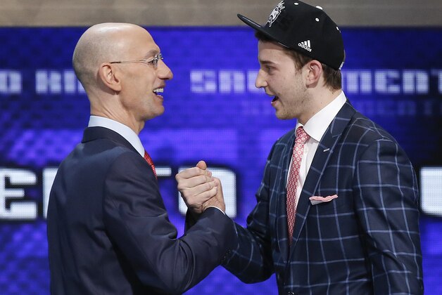 Nik Stauskas, right, is greeted by NBA Commissioner Adam Silver after being selected eighth overall by the Sacramento Kings during the 2014 NBA draft, Thursday, June 26, 2014, in New York. (AP Photo/Kathy Willens) Nik Stauskas, right, is greeted by NBA Commissioner Adam Silver after being selected eighth overall by the Sacramento Kings during the 2014 NBA draft, Thursday, June 26, 2014, in New York. (AP Photo/Kathy Willens)