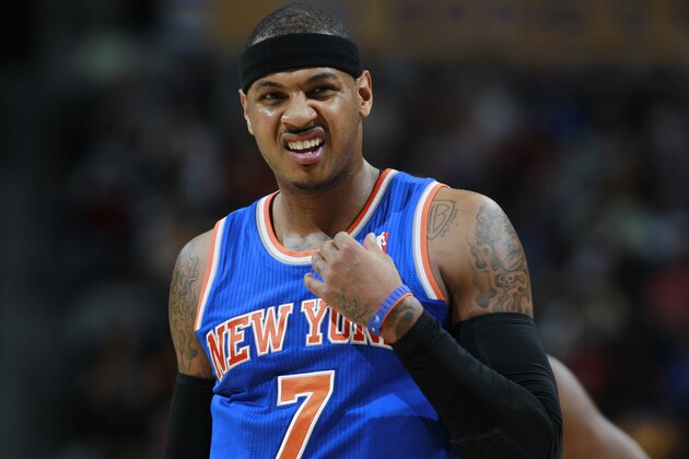 New York Knicks forward Carmelo Anthony reacts after being fouled while shooting against th Denver Nuggets in the first quarter of an NBA basketball game in Denver, Friday, Nov. 29, 2013. (AP Photo/David Zalubowski)