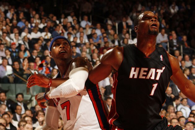 NEW YORK, NY - MAY 3:  Carmelo Anthony #7 of the New York Knicks and Chris Bosh #1 of the Miami Heat wait for a rebound in Game Three of the Eastern Conference Quarterfinals during the 2012 NBA Playoffs on May 3, 2012 at Madison Square Garden in New York City, New York. NOTE TO USER: User expressly acknowledges and agrees that, by downloading and or using this photograph, User is consenting to the terms and conditions of the Getty Images License Agreement. Mandatory Copyright Notice: Copyright 2012 NBAE  (Photo by Issac Baldizon/NBAE via Getty Images)
