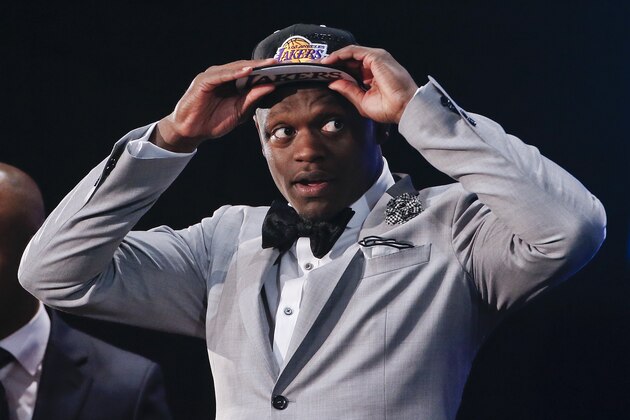 Kentucky forward Julius Randle dons a Los Angeles Lakers cap after being selected seventh overall by the Lakers during the 2014 NBA draft, Thursday, June 26, 2014, in New York.  (AP Photo/Jason DeCrow)
