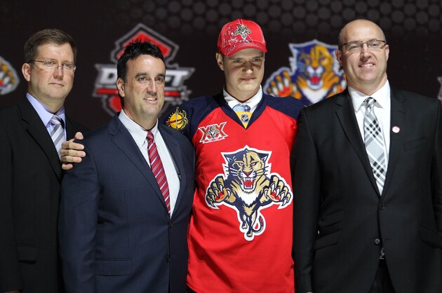 Jun 30, 2013; Newark, NJ, USA; Aleksander Barkov poses with team executives after being introduced as the number two overall pick to the Florida Panthers during the 2013 NHL Draft at the Prudential Center. Mandatory Credit: Ed Mulholland-USA TODAY Sports