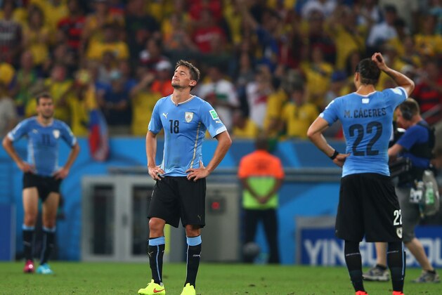 RIO DE JANEIRO, BRAZIL - JUNE 28:  Gaston Ramirez of Uruguay looks dejected after being defeated by Colombia in the 2014 FIFA World Cup Brazil round of 16 match between Colombia and Uruguay at Maracana on June 28, 2014 in Rio de Janeiro, Brazil.  (Photo by Clive Rose/Getty Images)