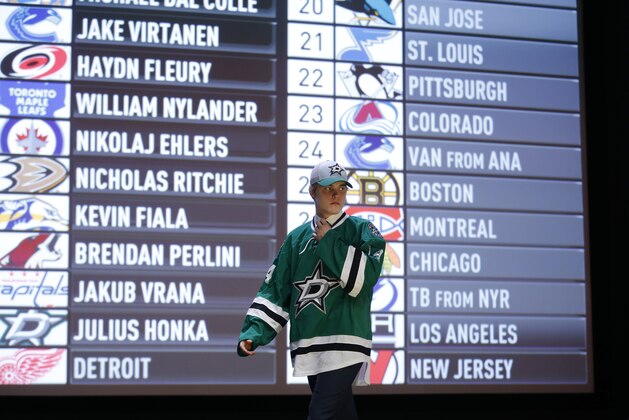 Julius Honka walks off the stage after being chosen 14th overall by the Dallas Stars during the first round of the NHL hockey draft, Friday, June 27, 2014, in Philadelphia. (AP Photo/Matt Slocum)
