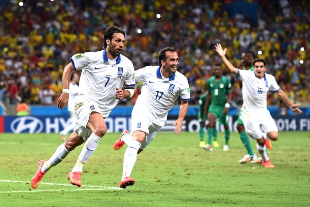FORTALEZA, BRAZIL - JUNE 24: Giorgos Samaras of Greece celebrates scoring his team's second goal on a penalty kick with Theofanis Gekas (C) during the 2014 FIFA World Cup Brazil Group C match between Greece and the Ivory Coast at Castelao on June 24, 2014 in Fortaleza, Brazil.  (Photo by Laurence Griffiths/Getty Images)