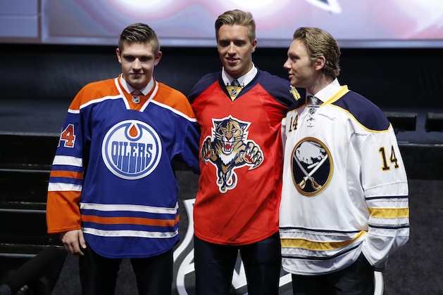 From left, Edmonton Oilers' Leon Draisaitl, Florida Panthers' Aaron Ekblad and Buffalo Sabres' Sam Reinhart pose for photographs during the first round of the NHL hockey draft, Friday, June 27, 2014, in Philadelphia. (AP Photo/Matt Slocum)