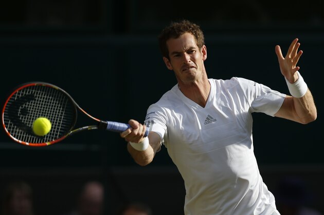 Andy Murray of Britain plays a return to Roberto Bautista Agut of Spain during their men's singles match at the All England Lawn Tennis Championships in Wimbledon, London, Friday, June 27, 2014. (AP Photo/Sang Tan)