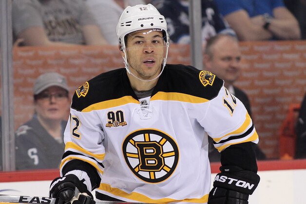WINNIPEG, MB - APRIL 10: Jarome Iginla #12 of the Boston Bruins skates down the ice during the second period of the NHL game against the Winnipeg Jets at the MTS Centre on April 10, 2014 in Winnipeg, Manitoba, Canada. (Photo by Marianne Helm/Getty Images)