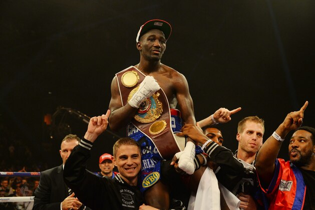 GLASGOW, SCOTLAND - MARCH 1 :  Terence Crawford celebrates his victory over Rick Burns during the WBO World Lightweight Championship Boxing match at the Glasgow SECC on March 1 2014 in Glasgow, Scotland. (Photo by Mark Runnacles/Getty Images)