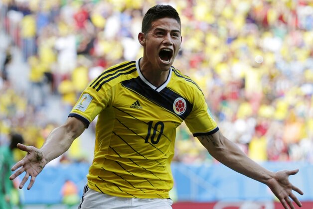 Colombia's James Rodriguez celebrates after scoring his side's first goal during the group C World Cup soccer match between Colombia and Ivory Coast at the Estadio Nacional in Brasilia, Brazil, Thursday, June 19, 2014. (AP Photo/Fernando Llano)