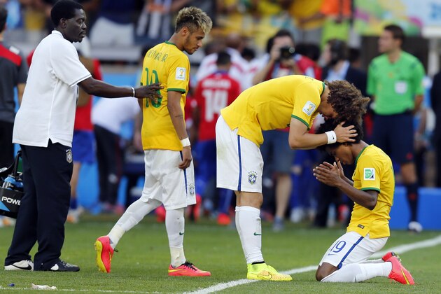 Brazil's Willian, right, Brazil's David Luiz and Brazil's Neymar celebrate after the World Cup round of 16 soccer match between Brazil and Chile at the Mineirao Stadium in Belo Horizonte, Brazil, Saturday, June 28, 2014. Brazil won 3-2 on penalties. Brazil won 3-2 on penalties.(AP Photo/Frank Augstein)