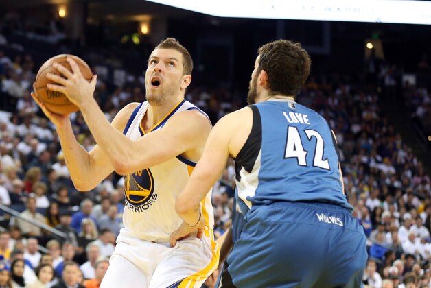 Apr 14, 2014; Oakland, CA, USA; Golden State Warriors forward David Lee (10) looks to shoot the ball against Minnesota Timberwolves forward Kevin Love (42) during the third quarter at Oracle Arena. The Golden State Warriors defeated the Minnesota Timberwolves 130-120. Mandatory Credit: Kelley L Cox-USA TODAY Sports