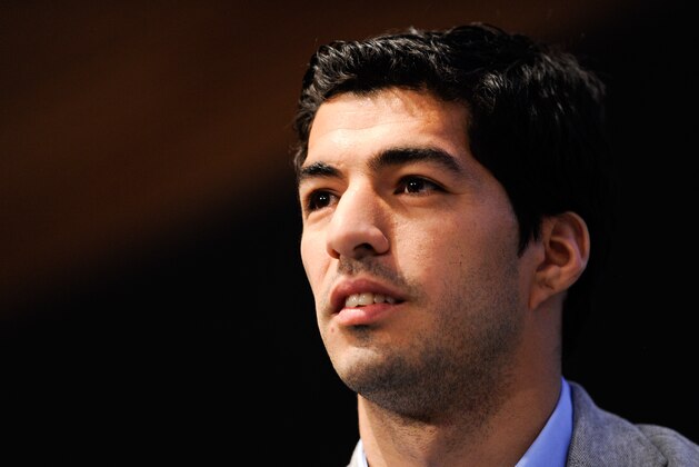 BARCELONA, SPAIN - MAY 14:  Luis Suarez of Liverpool faces the media during the presentation as new Ambassador for 888poker on May 14, 2014 in Barcelona, Spain.  (Photo by David Ramos/Getty Images)