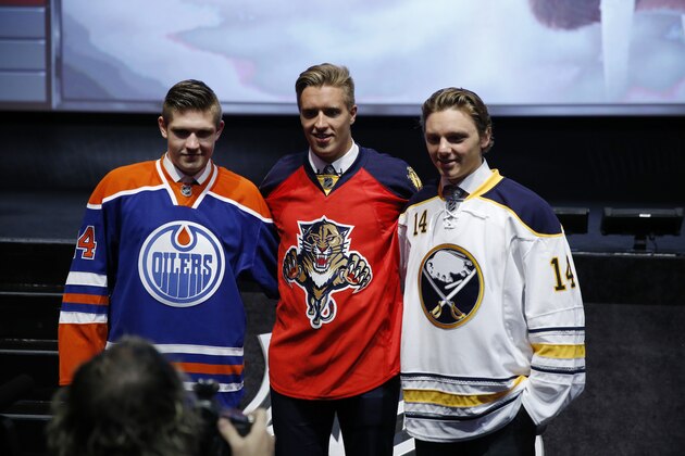 From left, Edmonton Oilers' Leon Draisaitl, Florida Panthers' Aaron Ekblad and Buffalo Sabres' Sam Reinhart pose for photographs during the first round of the NHL hockey draft, Friday, June 27, 2014, in Philadelphia. (AP Photo/Matt Slocum)