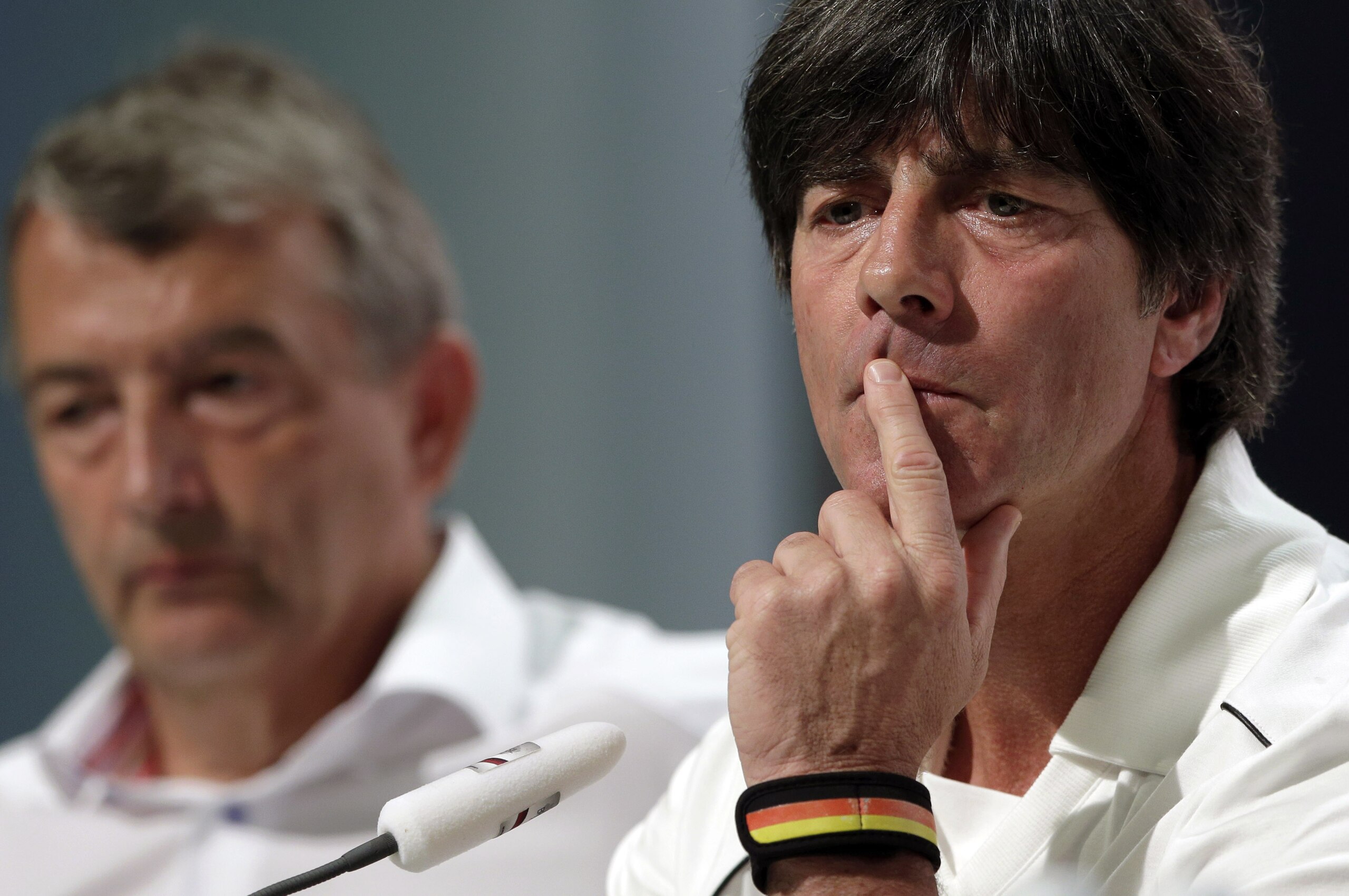 German national soccer team head coach Joachim Loew, right, listens to questions of journalists besides Wolfgang Niersbach, president of German Football Federation (DFB), during a news conference in Santo Andre near Porto Seguro, Brazil, Saturday, June 28, 2014. Germany will face Algeria in their round of 16 match of the 2014 soccer World Cup in Porto Alegro on Monday. (AP Photo/Matthias Schrader)