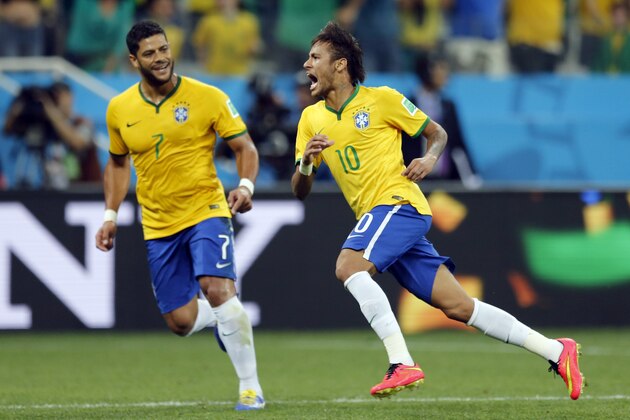 Brazil's Neymar, right, celebrates with teammate Hulk after scoring during the group A World Cup soccer match against Croatia in the opening game of the tournament at Itaquerao Stadium in Sao Paulo, Brazil, Thursday, June 12, 2014. (AP Photo/Frank Augstein)