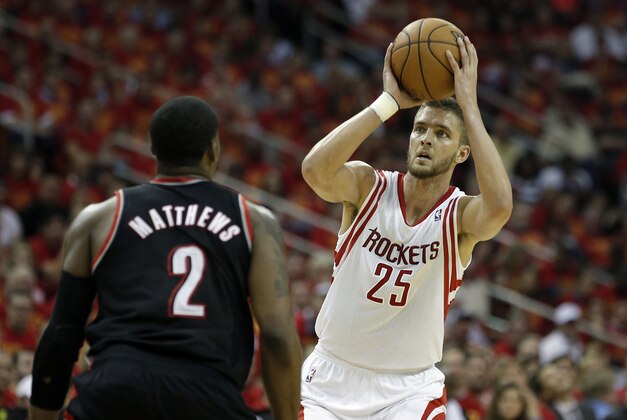 Apr 30, 2014; Houston, TX, USA; Houston Rockets forward Chandler Parsons (25) is defended by Portland Trail Blazers guard Wesley Matthews (2) during the second quarter in game five of the first round of the 2014 NBA Playoffs at Toyota Center. Mandatory Credit: Andrew Richardson-USA TODAY Sports