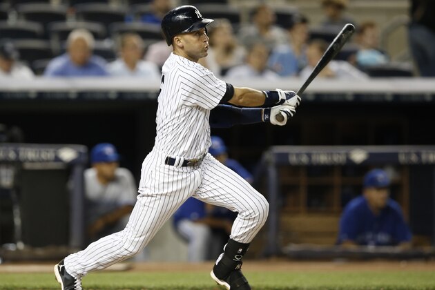New York Yankees Derek Jeter hits an eighth-inning double in a baseball game against the Toronto Blue Jays at Yankee Stadium in New York, Wednesday, June 18, 2014.  (AP Photo/Kathy Willens)