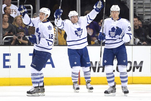 LOS ANGELES, CA - MARCH 13: Carl Gunnarsson #36 of the Toronto Maple Leafs reacts to his goal with Mason Raymond #12 and Phil Kessel #81 to tie the score 2-2 with the Los Angeles Kings during the second period at Staples Center on March 13, 2014 in Los Angeles, California. (Photo by Harry How/Getty Images) LOS ANGELES, CA - MARCH 13: Carl Gunnarsson #36 of the Toronto Maple Leafs reacts to his goal with Mason Raymond #12 and Phil Kessel #81 to tie the score 2-2 with the Los Angeles Kings during the second period at Staples Center on March 13, 2014 in Los Angeles, California. (Photo by Harry How/Getty Images)