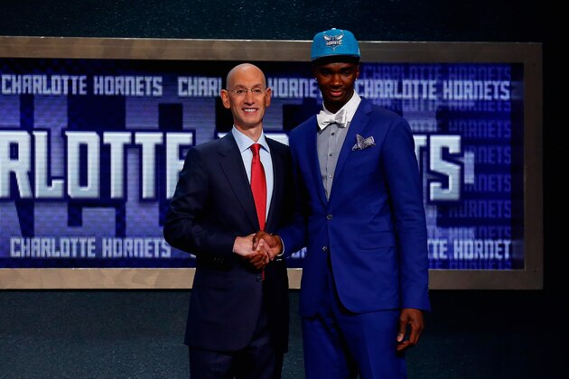 NEW YORK, NY - JUNE 26:  Noah Vonleh (R) of Indiana shakes hands with NBA Commissioner Adam Silver after being selected with the #9 overall pick by the Charlotte Hornets during the 2014 NBA Draft at Barclays Center on June 26, 2014 in the Brooklyn borough of New York City. NOTE TO USER: User expressly acknowledges and agrees that, by downloading and/or using this Photograph, user is consenting to the terms and conditions of the Getty Images License Agreement.  (Photo by Mike Stobe/Getty Images)