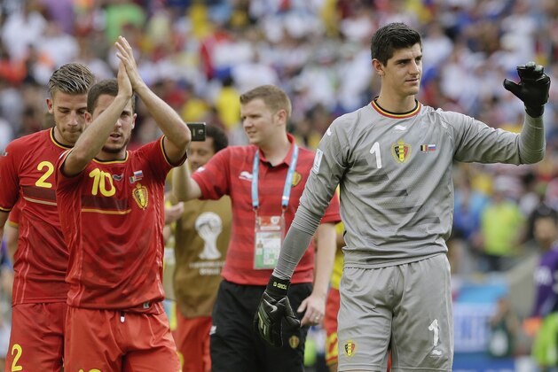 Belgium's goalkeeper Thibaut Courtois (1) and Belgium's Eden Hazard (10) wave to spectators following Belgium's 1-0 victory over Russia during the group H World Cup soccer match between Belgium and Russia at the Maracana Stadium in Rio de Janeiro, Brazil, Sunday, June 22, 2014. (AP Photo/Bernat Armangue)