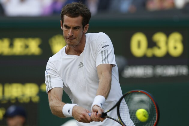 Andy Murray of Britain plays a return to Roberto Bautista Agut of Spain during their men's singles match at the All England Lawn Tennis Championships in Wimbledon, London, Friday June 27, 2014. (AP Photo/Sang Tan)