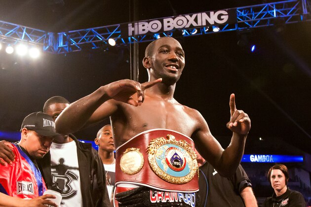 Terence Crawford wears the WBO lightweight title belt after defeating Yuriorkis Gamboa in the ninth round of the boxing bout Saturday, June 28, 2014, in Omaha, Neb. (AP Photo/John Peterson)