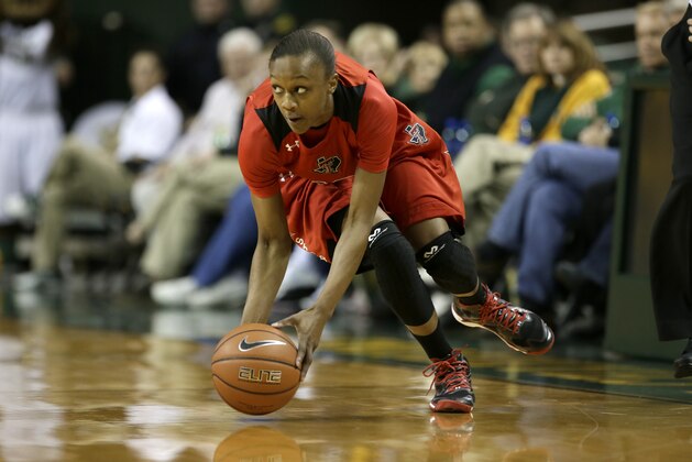 Texas Tech's Amber Battle (12) picks up a loose ball at mid court during an NCAA college basketball game against Baylor, Wednesday, Jan. 29, 2014, in Waco, Texas. (AP Photo/Tony Gutierrez)