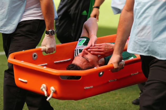 FORTALEZA, BRAZIL - JUNE 29: Hector Moreno of Mexico is stretchered off the field during the 2014 FIFA World Cup Brazil Round of 16 match between Netherlands and Mexico at Castelao on June 29, 2014 in Fortaleza, Brazil.  (Photo by Robert Cianflone/Getty Images)