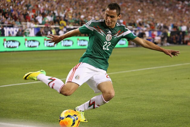 GLENDALE, AZ - APRIL 02:  Paul Aguilar #22 of Mexico centers the ball during the International Friendly against USA at University of Phoenix Stadium on April 2, 2014 in Glendale, Arizona. Mexico and USA played to a 2-2 tie. (Photo by Christian Petersen/Getty Images)