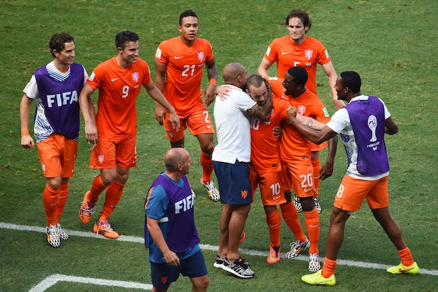 FORTALEZA, BRAZIL - JUNE 29:  Wesley Sneijder of the Netherlands celebrates scoring his team's first goal with teammates during the 2014 FIFA World Cup Brazil Round of 16 match between Netherlands and Mexico at Castelao on June 29, 2014 in Fortaleza, Brazil.  (Photo by Jamie McDonald/Getty Images)