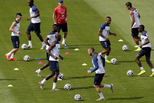 France's players run on the field during a training session at Santa Cruz stadium in Ribeirao Preto, Brazil, Saturday, June 28, 2014. France will face Nigeria on Monday in the round of 16 at the World Cup. (AP Photo/David Vincent)