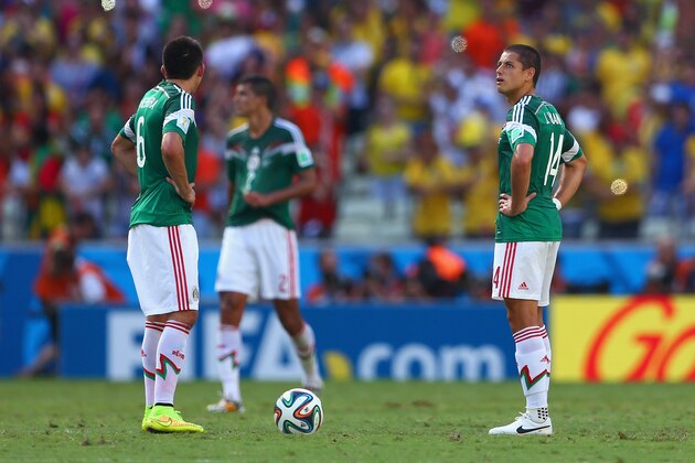 FORTALEZA, BRAZIL - JUNE 29:  Hector Herrera (L) and Javier Hernandez of Mexico look on after allowing a goal during the 2014 FIFA World Cup Brazil Round of 16 match between Netherlands and Mexico at Castelao on June 29, 2014 in Fortaleza, Brazil.  (Photo by Michael Steele/Getty Images)