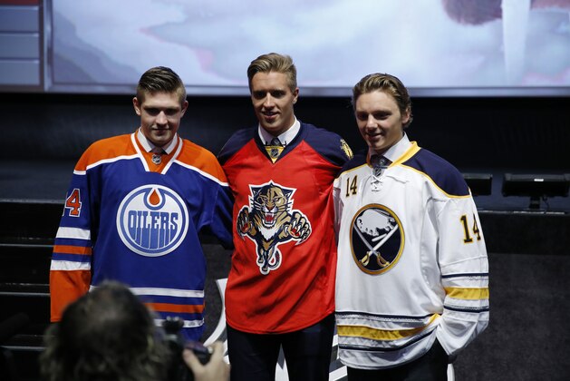 From left, Edmonton Oilers' Leon Draisaitl, Florida Panthers' Aaron Ekblad and Buffalo Sabres' Sam Reinhart pose for photographs during the first round of the NHL hockey draft, Friday, June 27, 2014, in Philadelphia. (AP Photo/Matt Slocum)