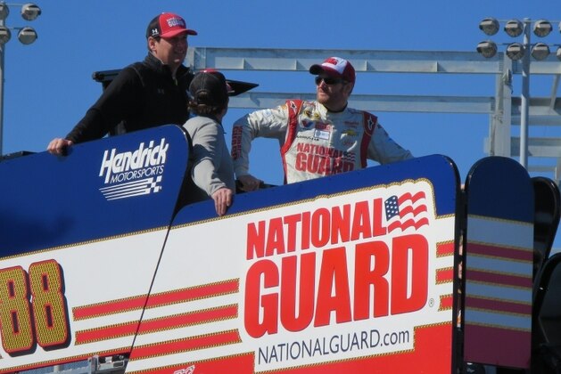 Dale Earnhardt Jr. watches Daytona qualifying from top of the No. 88 hauler.