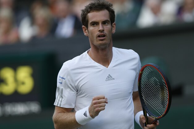 Andy Murray of Britain pumps a fist after winning a point against Roberto Bautista Agut of Spain during their men's singles match at the All England Lawn Tennis Championships in Wimbledon, London, Friday June 27, 2014. (AP Photo/Sang Tan)