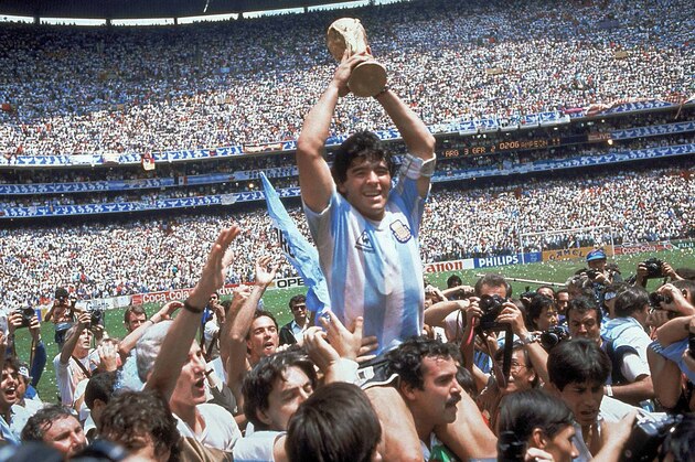 FILE - In this June 29, 1986, file photo, Diego Maradona, holds up the trophy, after Argentina beat West Germany 3-2 in their World Cup soccer final match, at the Atzeca Stadium, in Mexico City. On this day: Maradona leads Argentina to its second World Cup triumph. (AP Photo/Carlo Fumagalli, File)