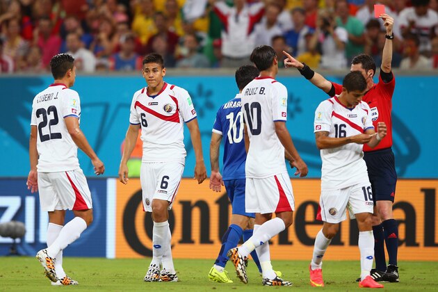 RECIFE, BRAZIL - JUNE 29:  Oscar Duarte of Costa Rica (2nd L) is shown a red card after his second bookable offense by referee Benjamin Williams during the 2014 FIFA World Cup Brazil Round of 16 match between Costa Rica and Greece at Arena Pernambuco on June 29, 2014 in Recife, Brazil.  (Photo by Paul Gilham/Getty Images)