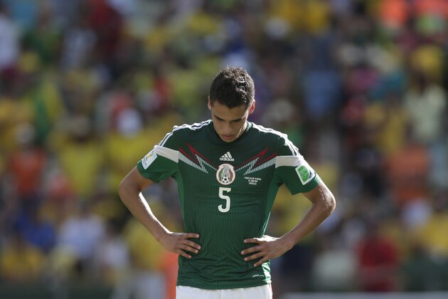 Mexico's Diego Reyes reacts after the World Cup round of 16 soccer match between the Netherlands and Mexico at the Arena Castelao in Fortaleza, Brazil, Sunday, June 29, 2014. The Netherlands won the match 2-1.(AP Photo/Marcio Jose Sanchez)